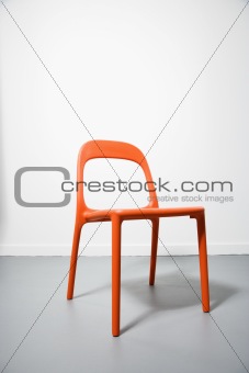 An orange modern chair.