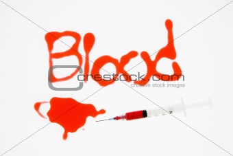 Needle with blood.
