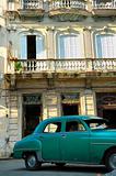 Green vintage car parked in Havana street