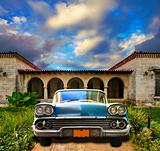 Old car parked in tropical house, cuba