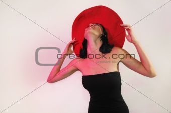 Elegant lady wearing big red hat