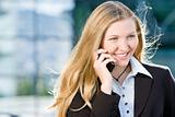 Blonde business woman on mobile phone