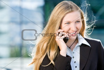 Blonde business woman on mobile phone