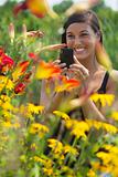 Beautiful Young Woman Photographing Flowers