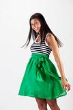 Attractive Young Woman in a Green Skirt