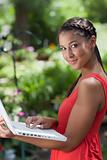 Young Woman Posing With a Laptop Outdoors