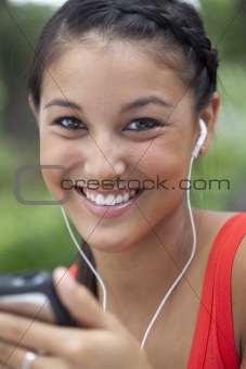 Cute Young Woman Using an MP3 Player