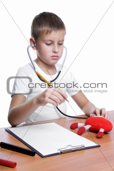 cute young boy playing doctor 
