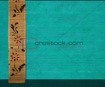 Flower bamboo banner on aquamarine ribbed wood