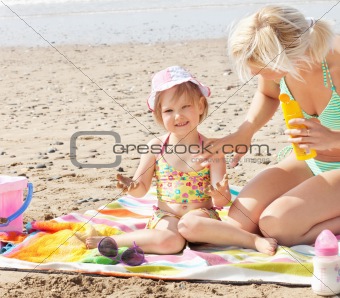 Smiling little girl at the beach 