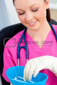 Caucasian nurse holding pills in a hospital