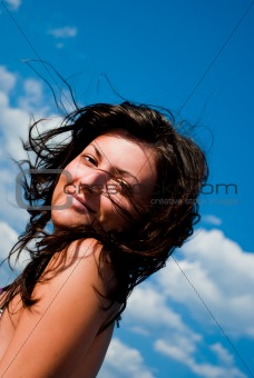 Young Woman over blue Sky