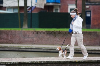 Girl walking with a dog 
