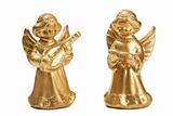 two golden christmas angel figurines as musicians