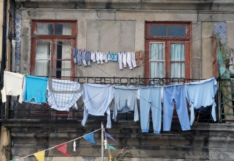 Washed clothes drying outside of an old house. Porto Portugal