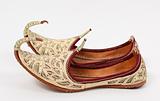 Traditional Arabic shoes over white background
