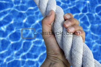 man hand grab grip sport blue pool big rope