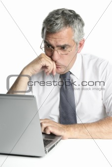 senior businessmen focused on laptop work 