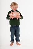 Little Boy Holding a Piggy Bank