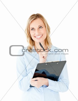 Thoughful young businesswoman holding a clipboard