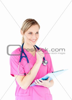 Ambitious female surgeon holding a clipboard