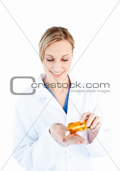 Close-up of a caucasian doctor holding pills