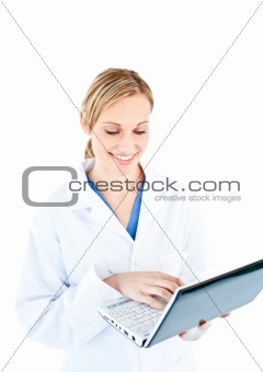 Cute female doctor holding a laptop