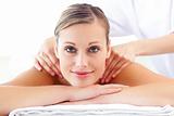 Glowing caucasian woman enjoying a back massage