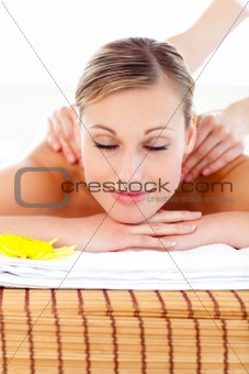 Portrait of a bright woman lying on a massage table