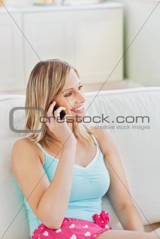attractive woman with pyjamas talking on the phone