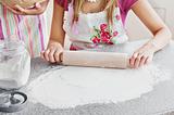 Close-up of two caucasian woman baking in the kitchen 