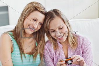 Friends checking out pictures