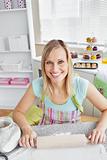 Cheerful woman baking in the kitchen