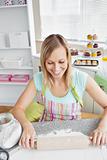 Smiling woman baking in the kitchen 