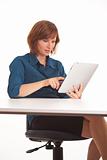 Young business woman at desk with I pad