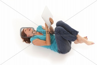 Young woman casually laying on floor with I pad