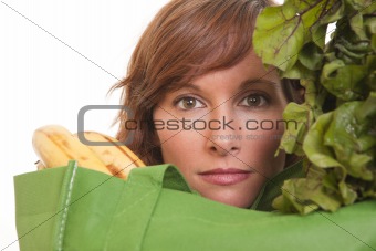 Young woman with green bag of healthy food and vegetables