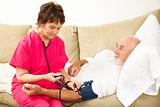 Home Nurse Takes Blood Pressure