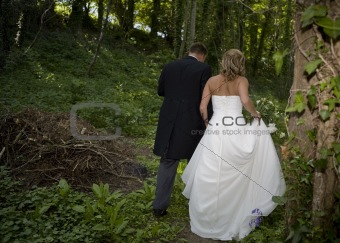 bride and groom in bluebell woods
