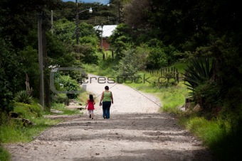 Woman and child walking in Costa Rica