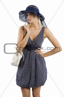 elegant woman with hat and hand bag