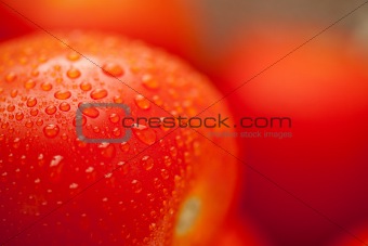 Macro of Fresh, Vibrant Roma Tomatoes with Water Drops Abstract.
