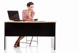 pretty woman in desk with computer, isolated on white background. Studio shot.