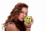 Beautiful girl eating a green apple