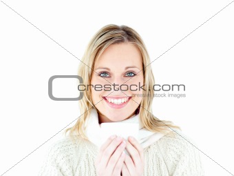 Smiling woman wearing a pullover enjoying a hot coffee