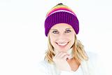 Merry woman with a colorful hat smiling at the camera