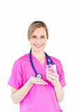 Pretty female doctor holding pills and water