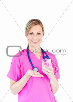Pretty female doctor holding pills and water