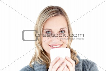 Beautiful woman enjoying a hot coffee standing