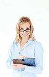 Smiling businesswoman wearing glasses and holding a clipboard